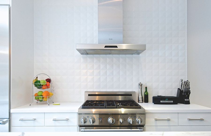 White ceramic tile backsplash in the kitchen adds depth to the setting [From: Andrew Snow Photography]