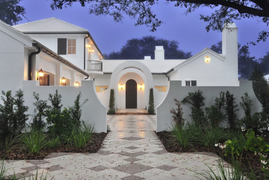 White stucco home with a front garden