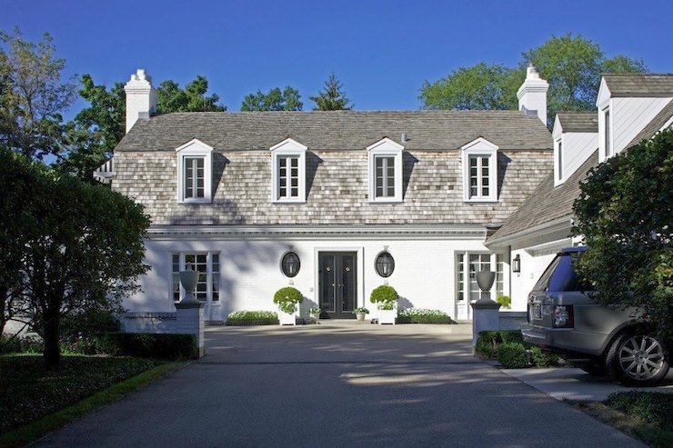 White stucco home with a shingled roof