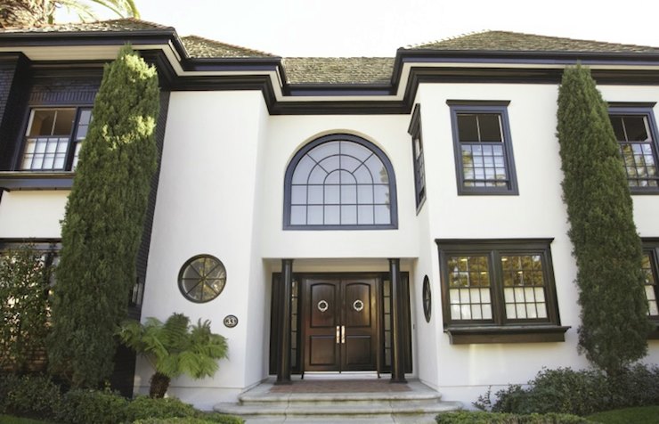 White stucco home with dark trim