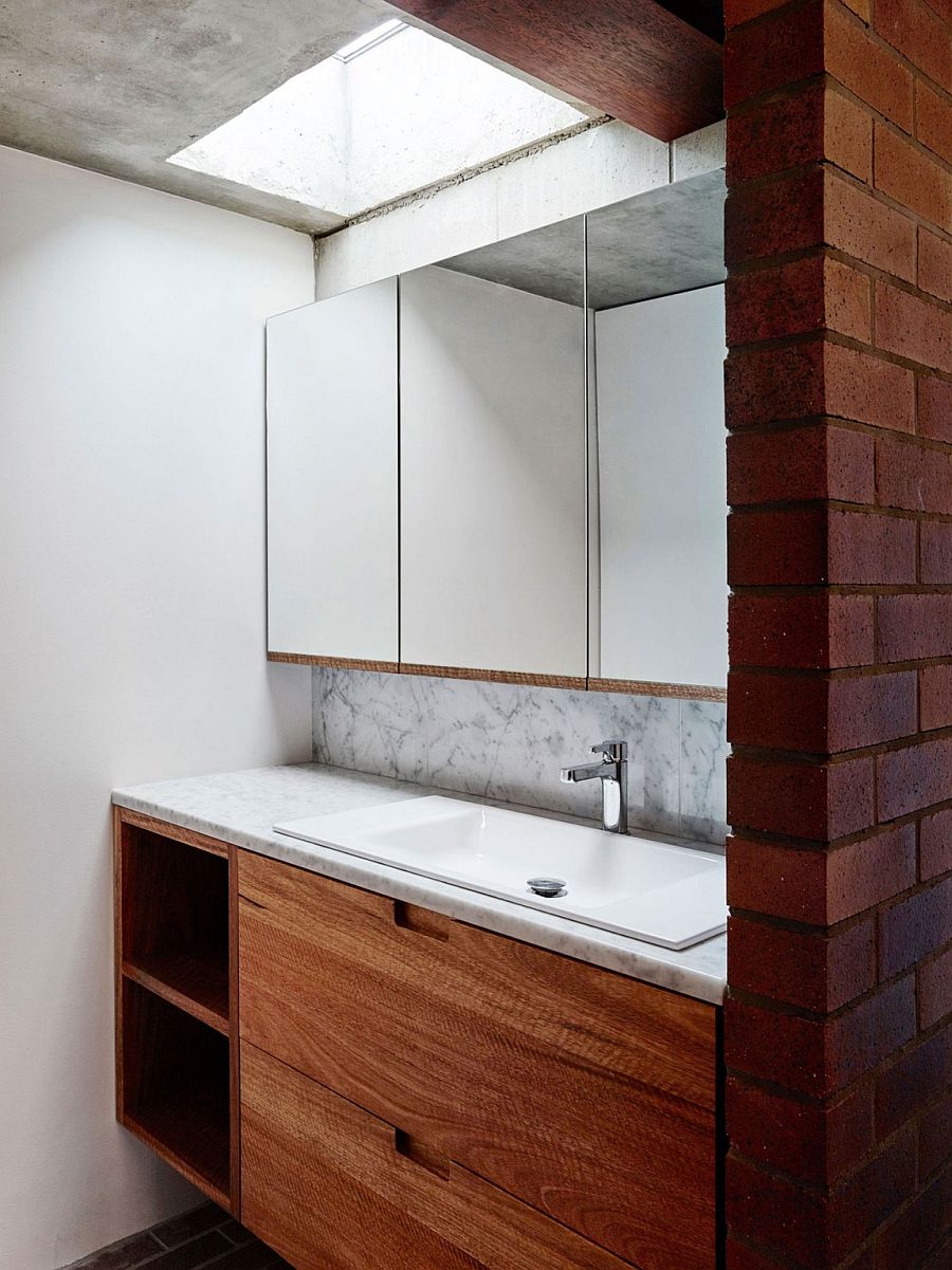 Wooden bathroom vanity with marble countertop
