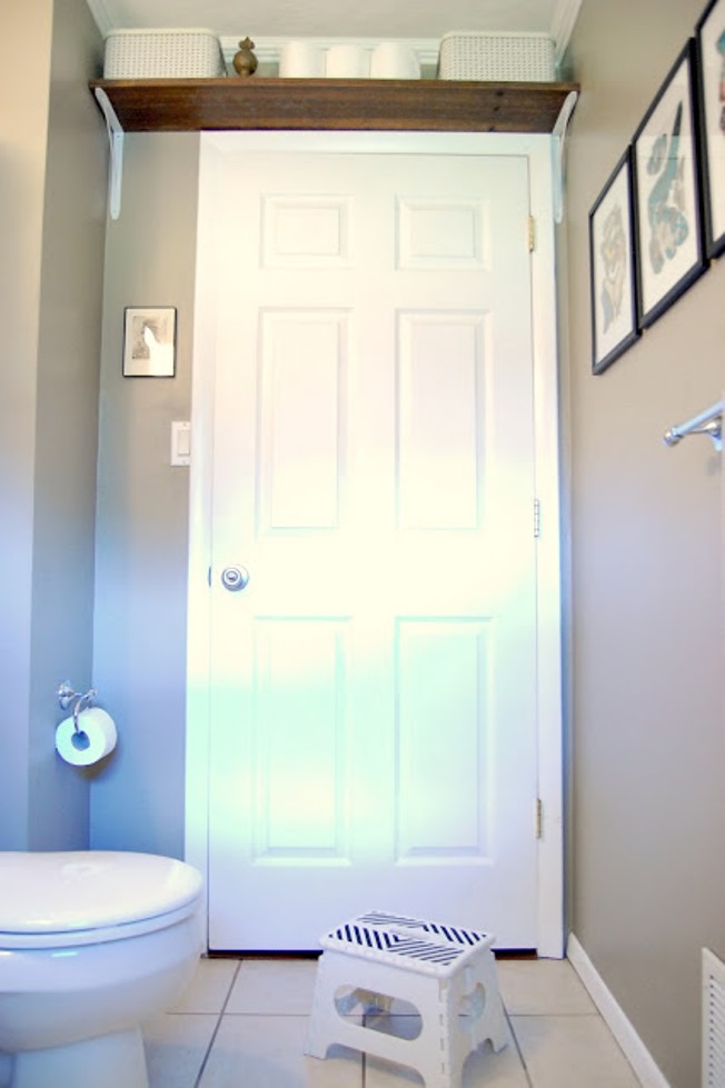 Shelf above the bathroom door for additional storage space