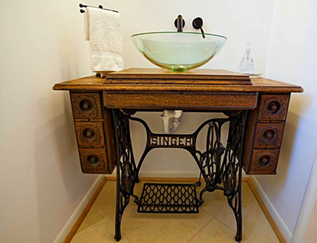 Old sewing machine used as DIY bathroom vanity