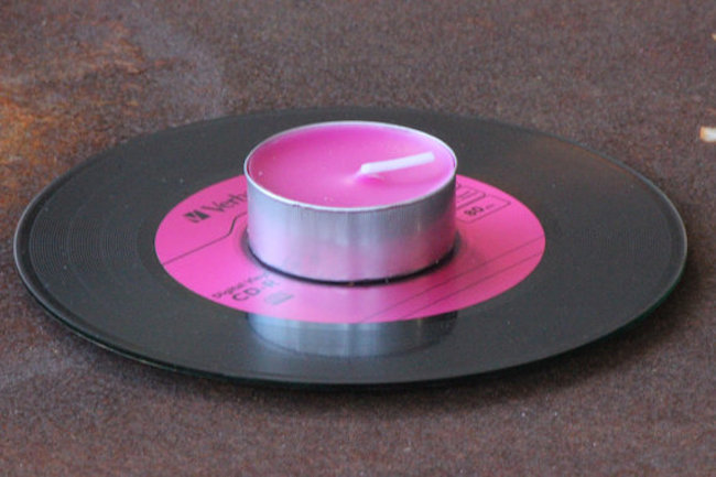 Pink tea light candle on pink digital vinyl CD