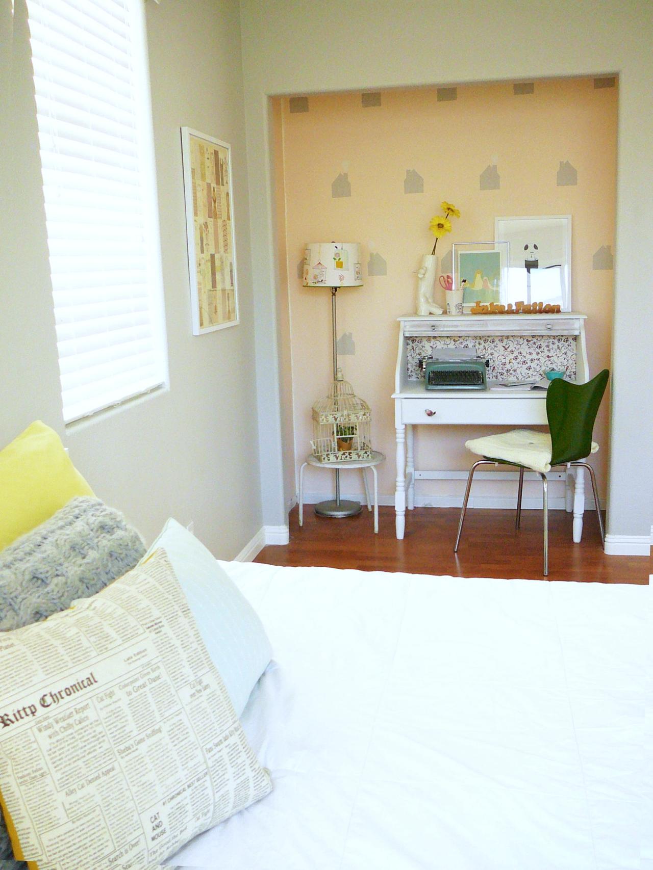 Shallow and long closet with wallpaper used as office space