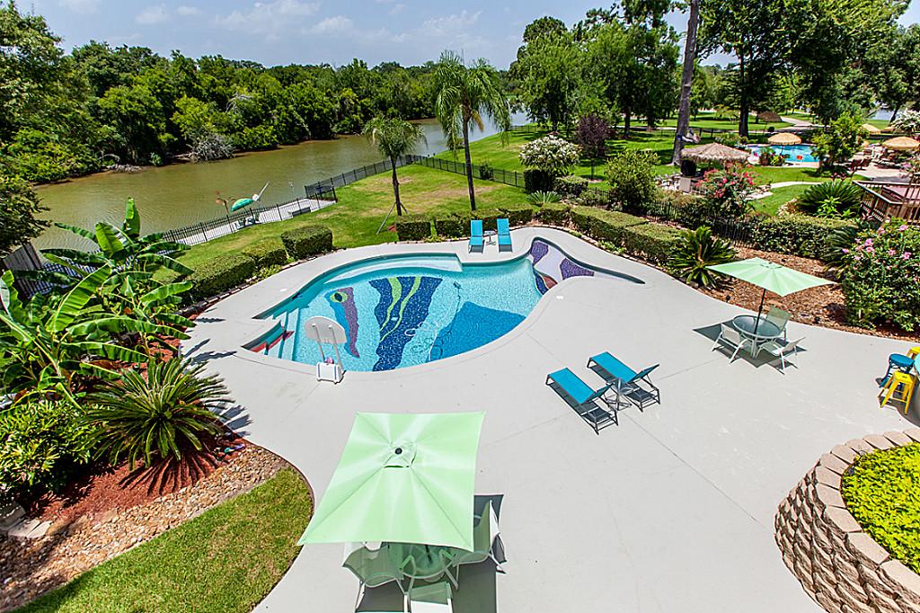 Gorgeous fish-shaped pool si perfect for the tropical backyard