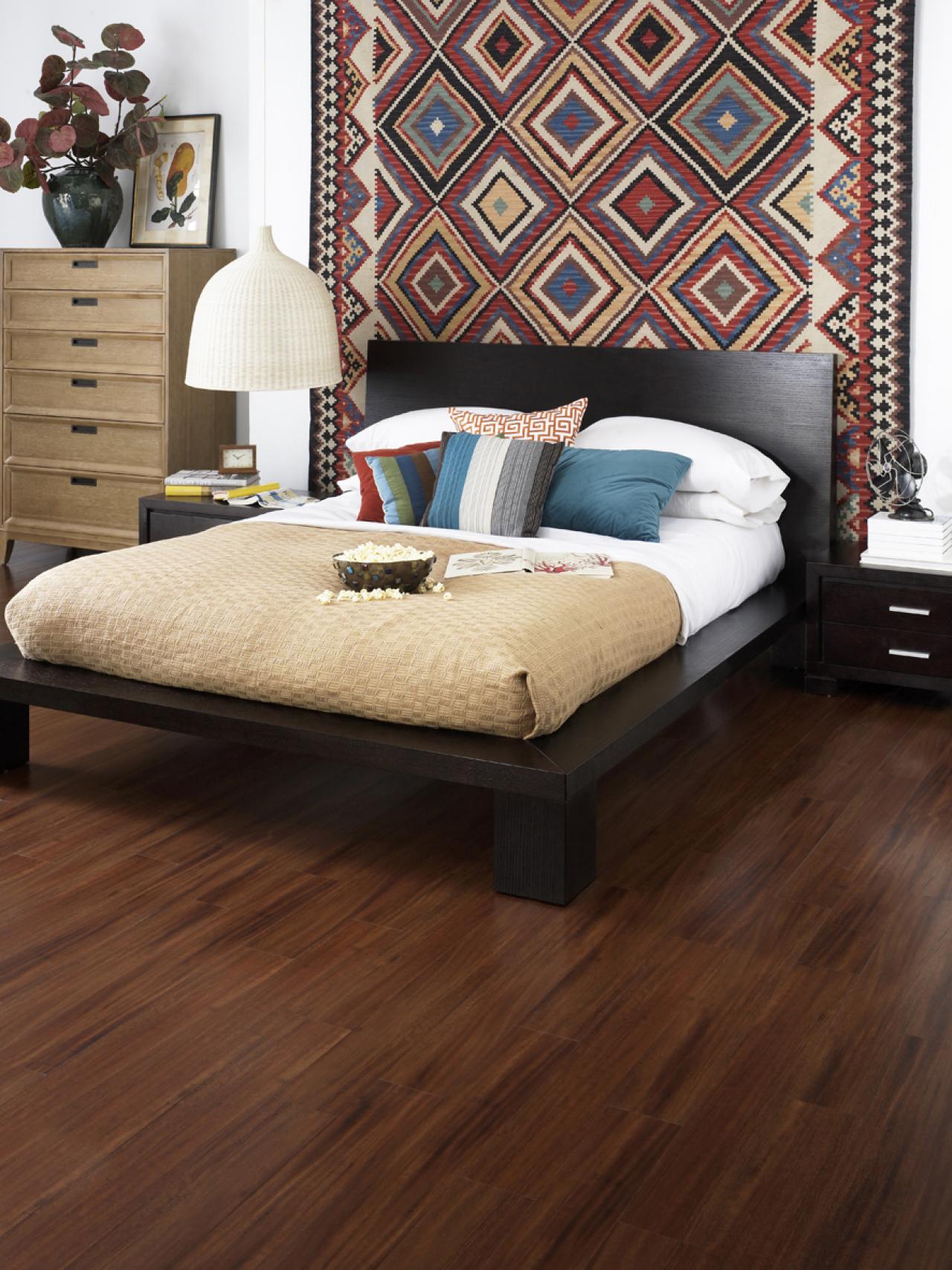 Bedroom with hardwood floor and a colorful backdrop