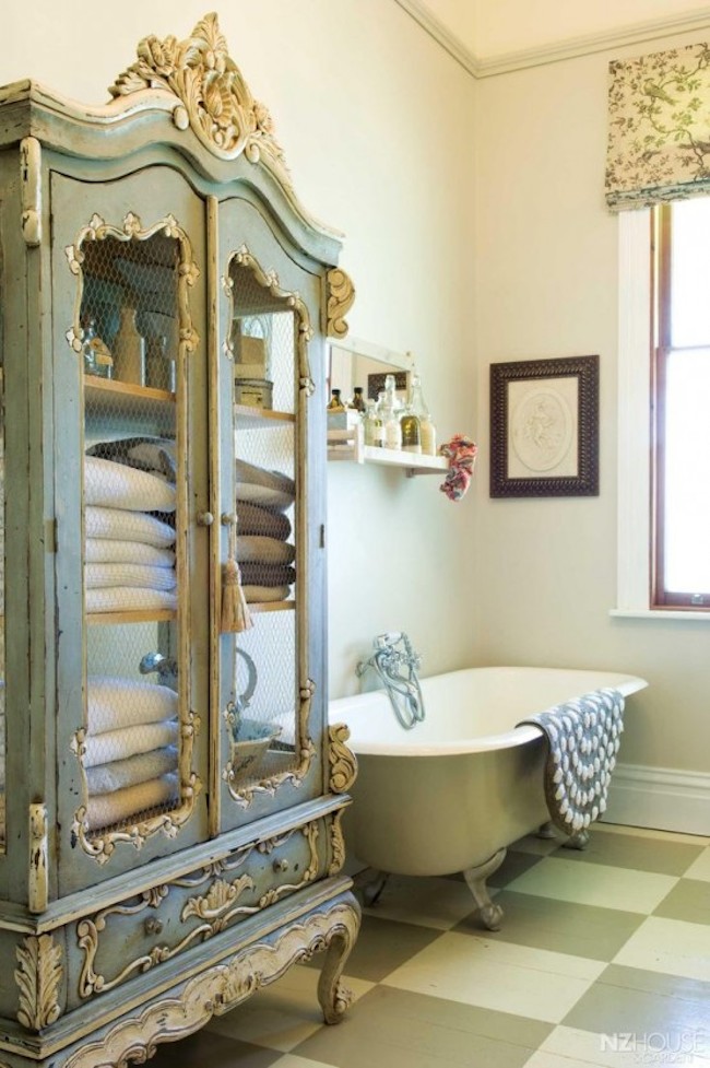 Gorgeous green and gold armoire inside the bathroom