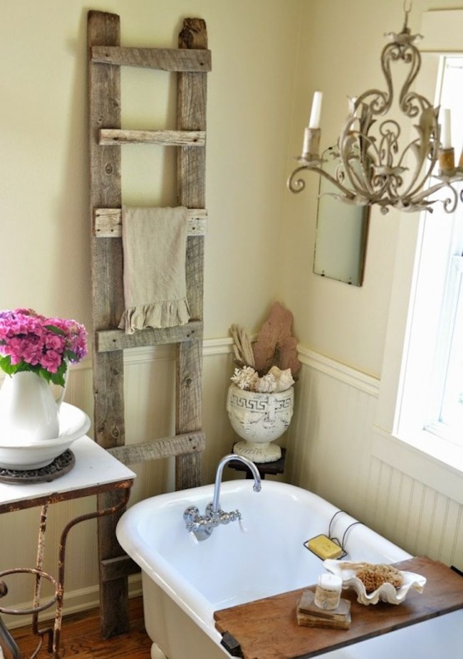 Wooden ladder adds a country feel to this shabby chic bathroom