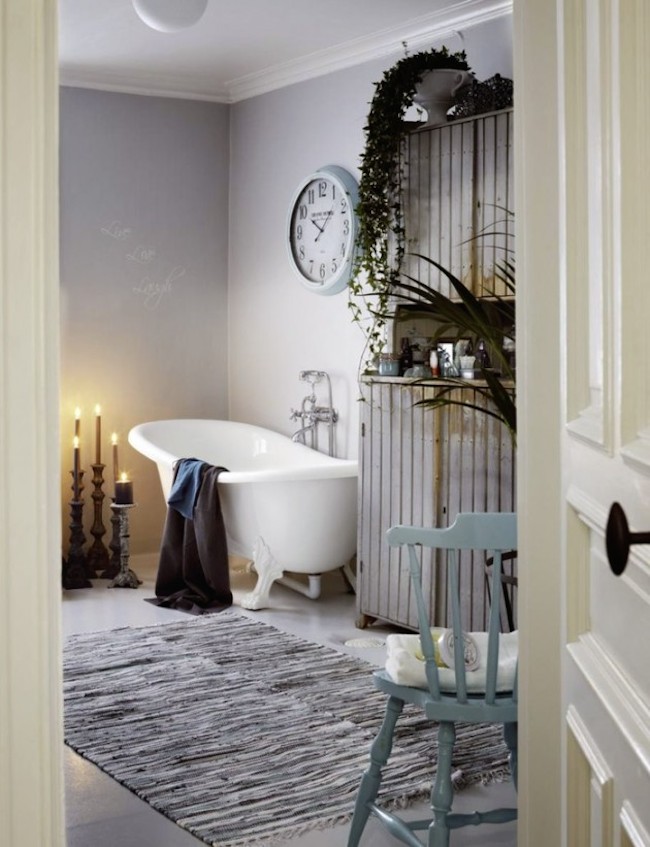 Large wall clock becomes a unique addition in this shabby chic bathroom
