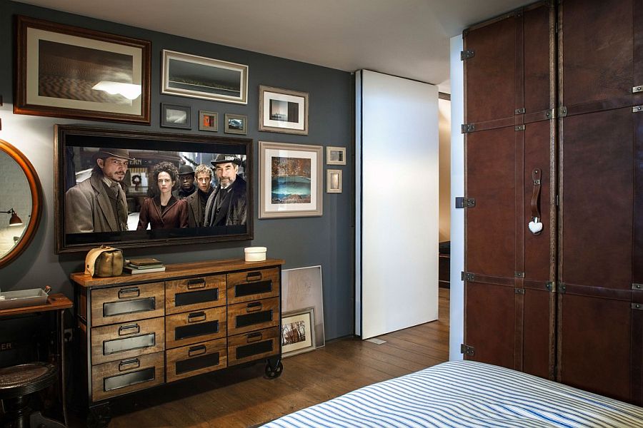 A gallery wall in the bedroom with television and vintage decor