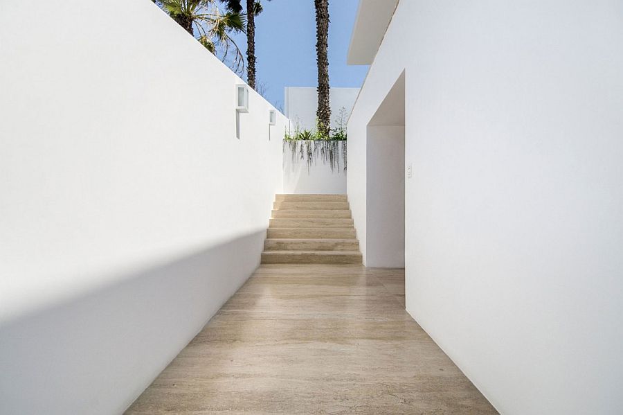 All-white exterior of the Peru home with narrow entrance