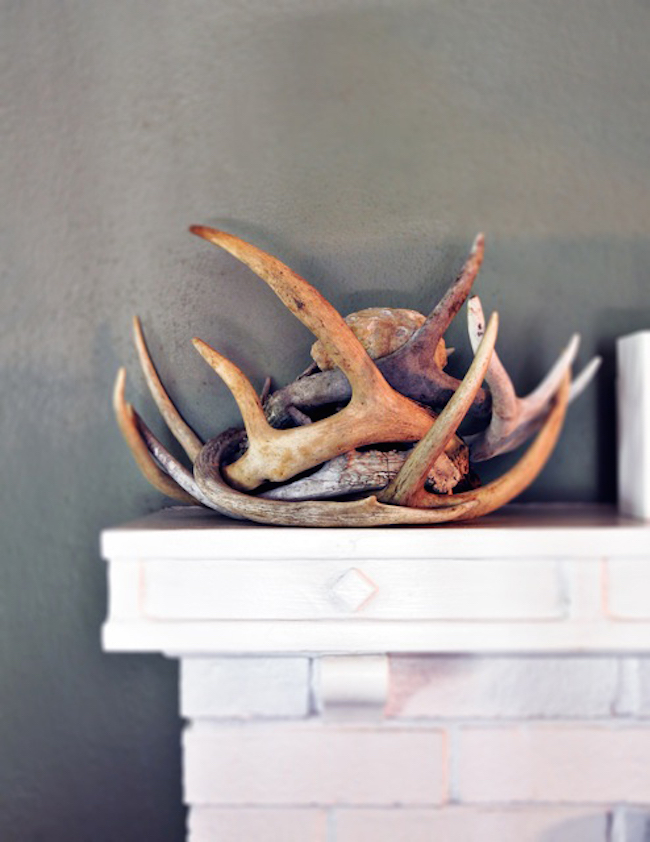 Antler decor on fireplace mantel