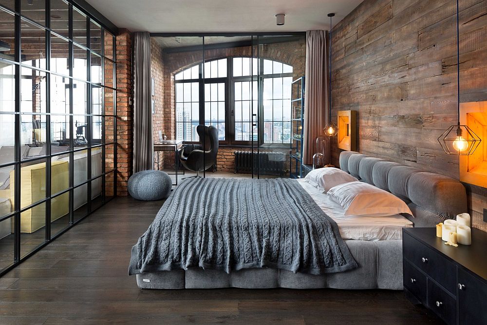 Bachelor bedroom inside loft apartment with bedside pendants, wooden and glass walls