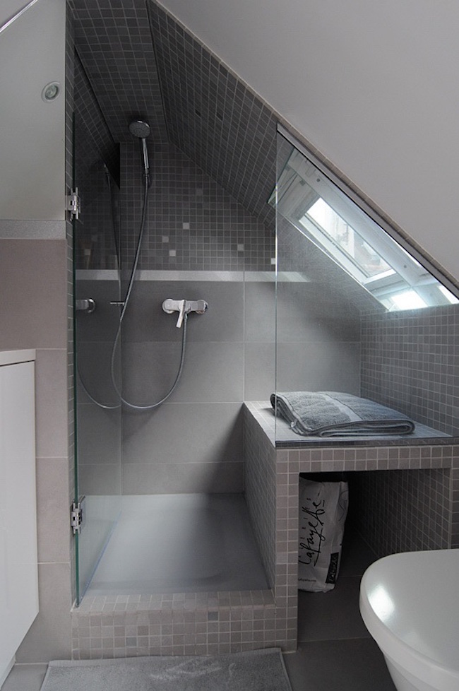 Beautiful gray tiled shower in a small attic