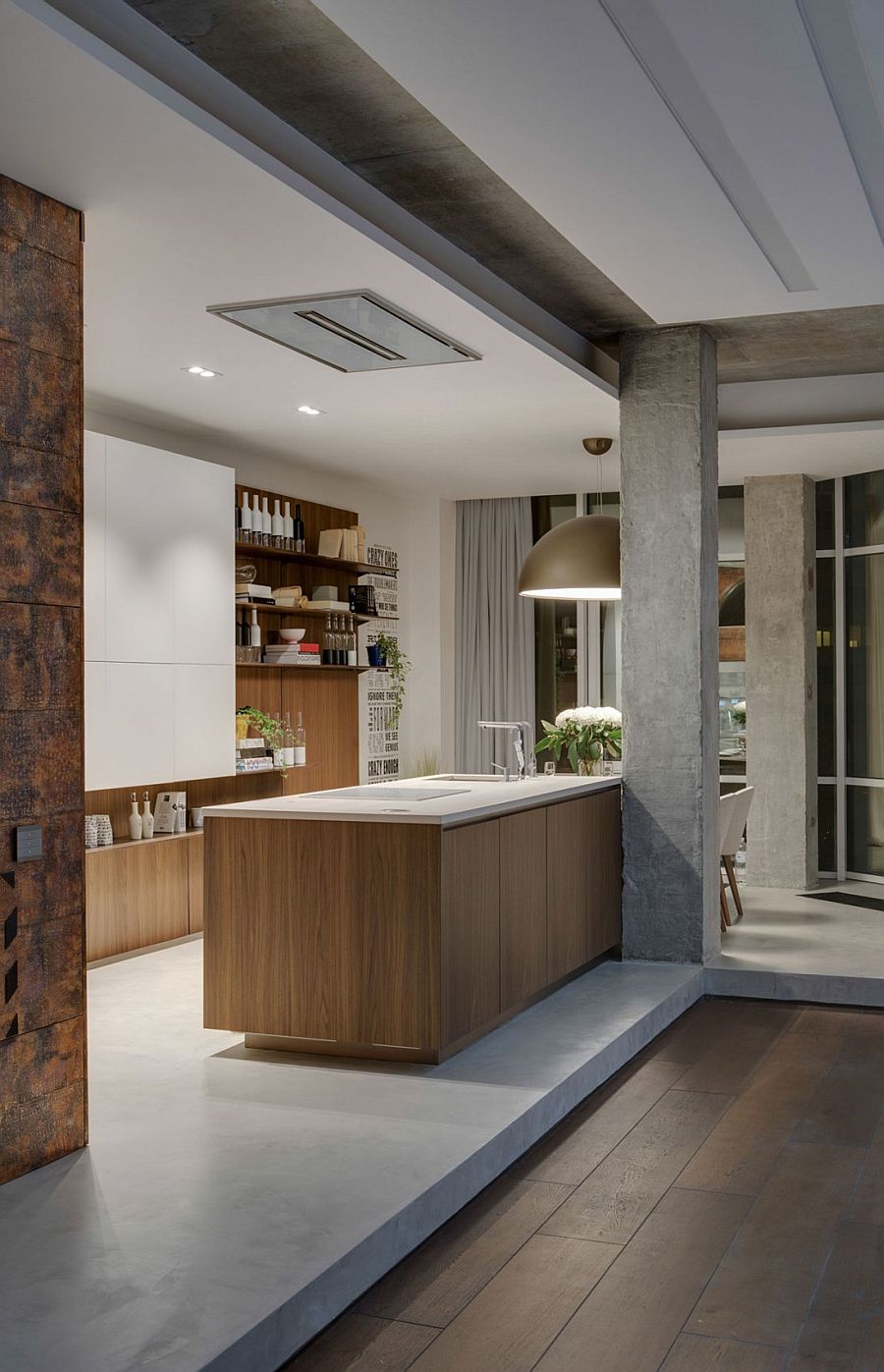 Beautiful kitchen design with large industrial lighting and floating wooden shelves