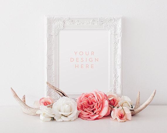 Beautiful white pictures frame with deer antlers