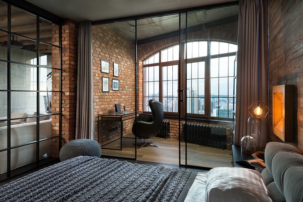 Bedroom with a charming workspace behind glass partition