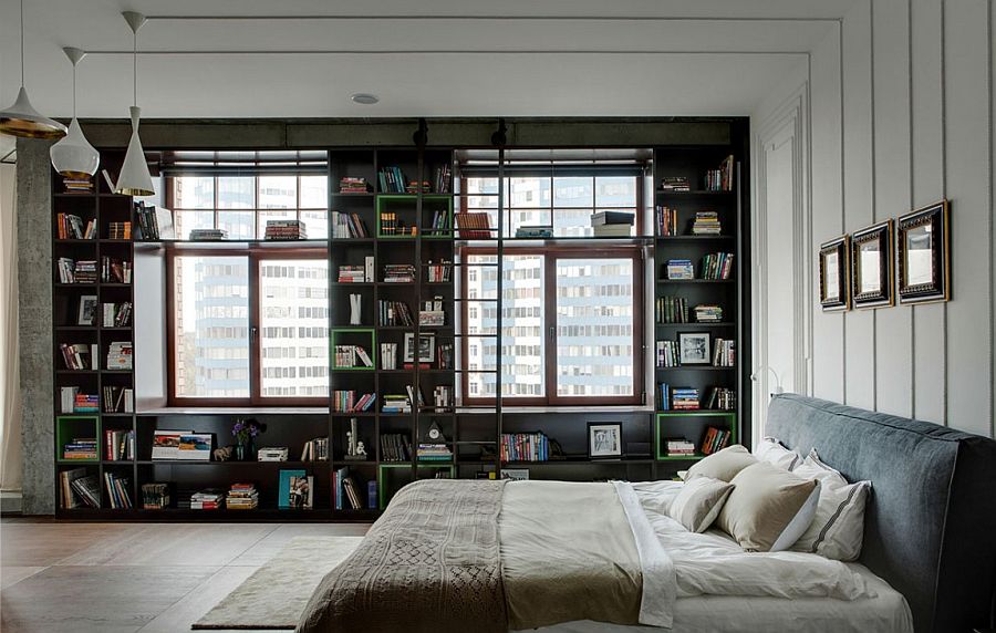 Bedroom with bookshelf and Tom Dixon pendants