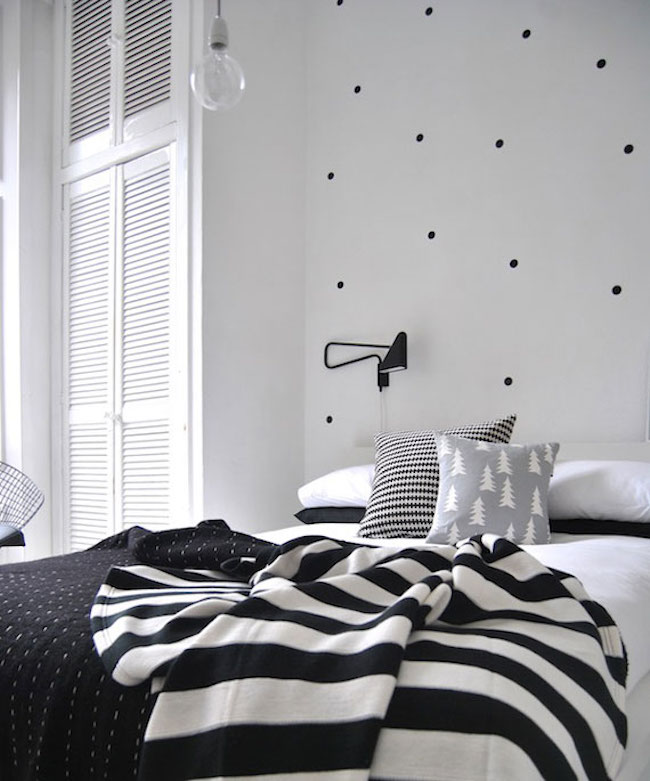 Black polka dot wall decals combined with other bedding patterns