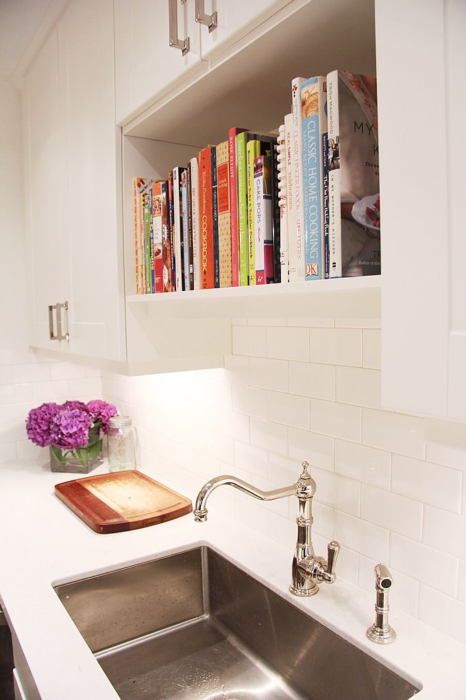 Bookshelf directly above kitchen sink