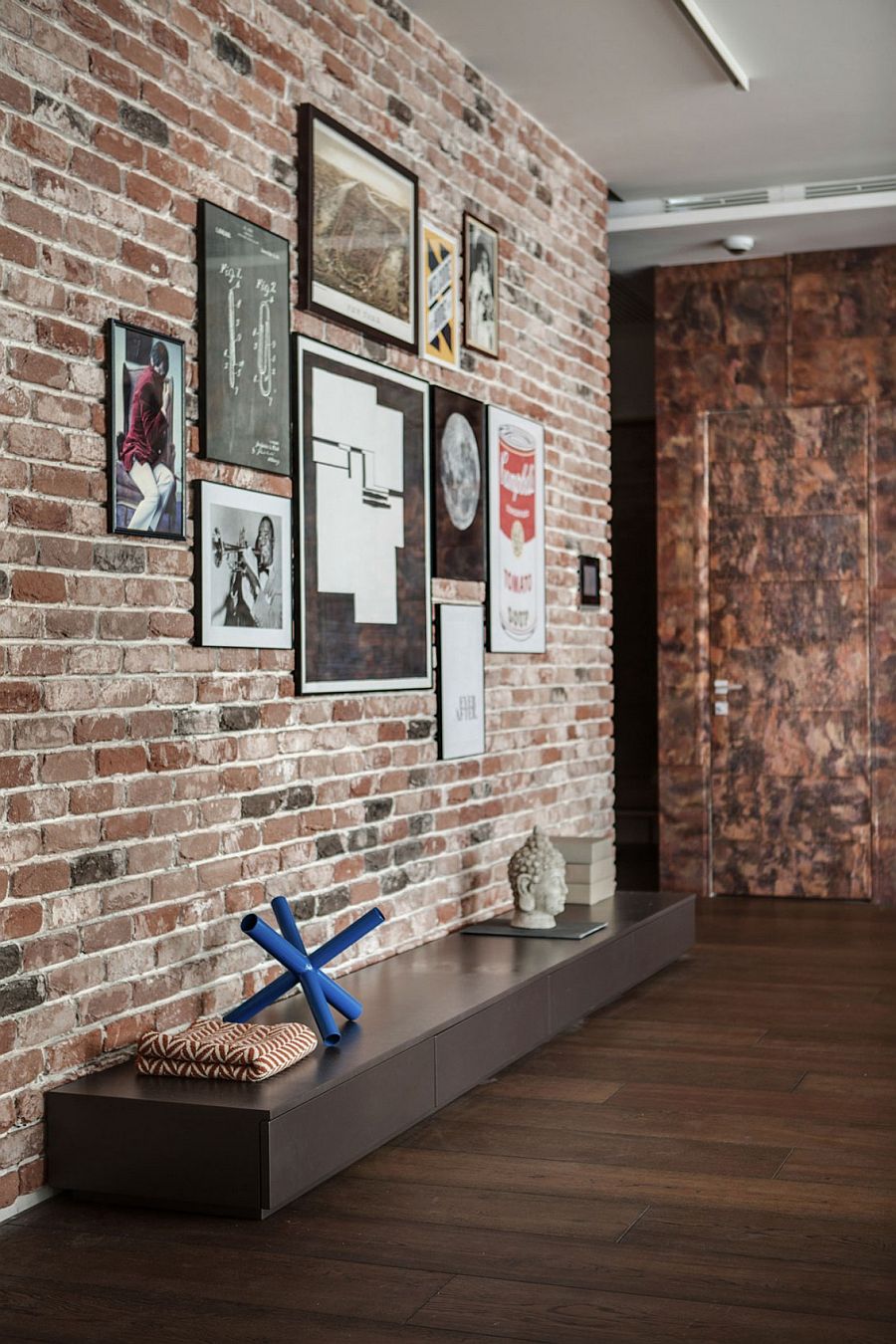 Brick wall turned into a creative gallery wall
