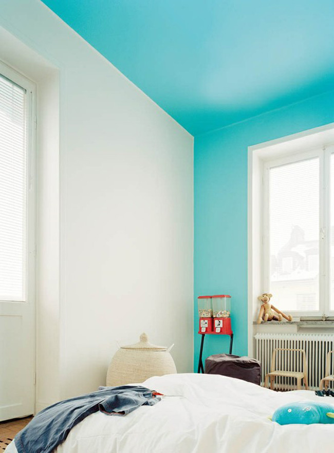 Bright blue color blocking on one wall and ceiling