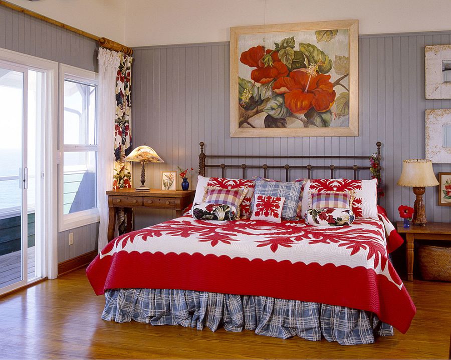 Bright, fabulous bedding and wall art in red highlight the tropical theme