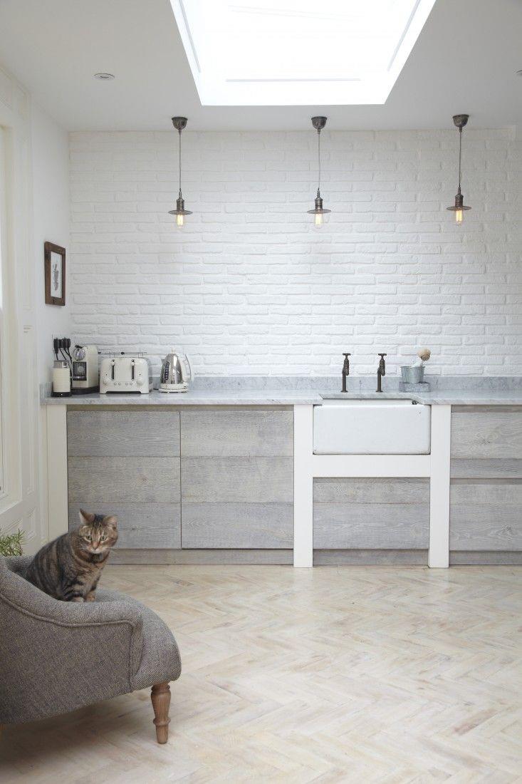 Bright modern kitchen with a herringbone floor