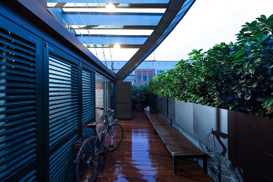 Cantilevered aluminum planters with plants create an aerial courtyard