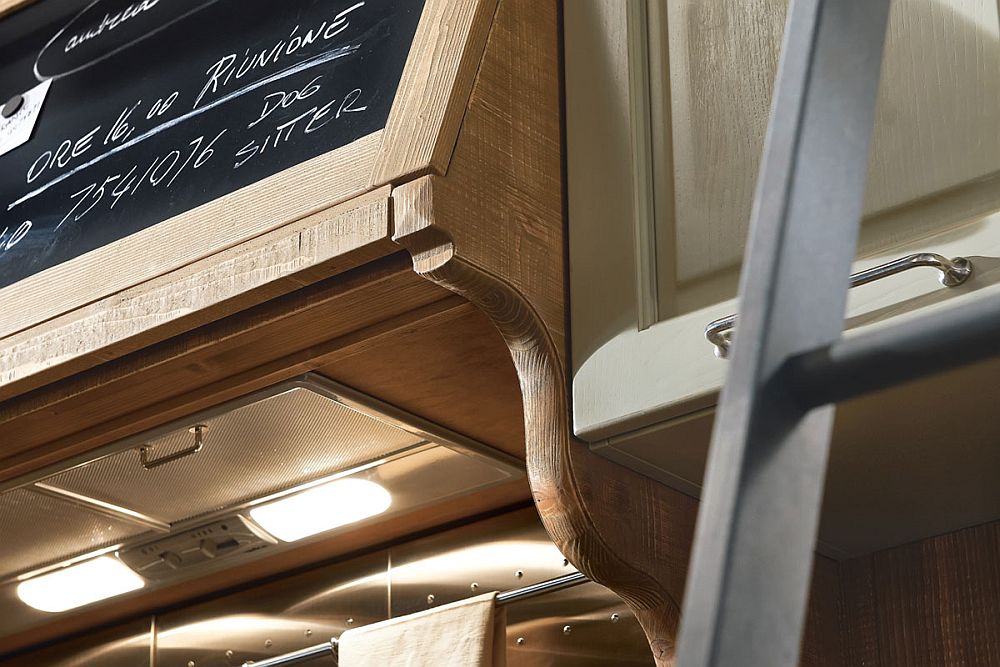 Carfeully crafted woden hoods and details shape the lovely Molita kitchen