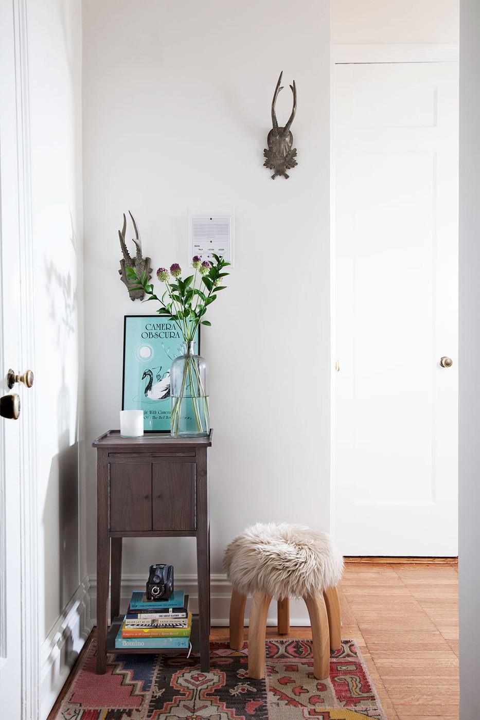 Compact table on a small entryway wall