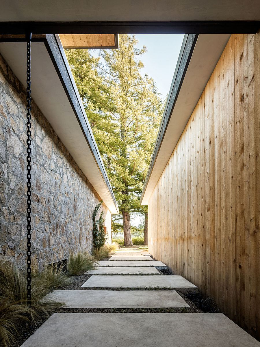Contrasting sections of the home in stone and cedar