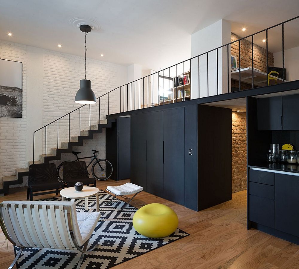 Dark cabinets and kitchen create a striking visual in the living room