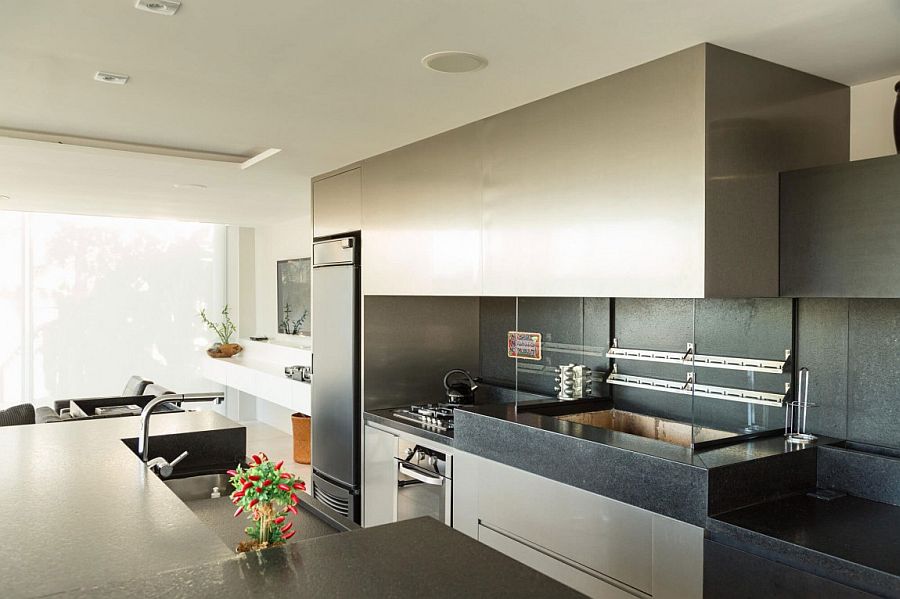 Dark kitchen worktstaion and backsplash in stone