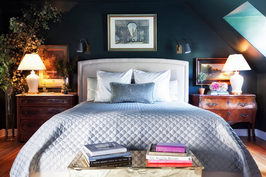 Dark, moody master bedroom with contrasting bedside tables