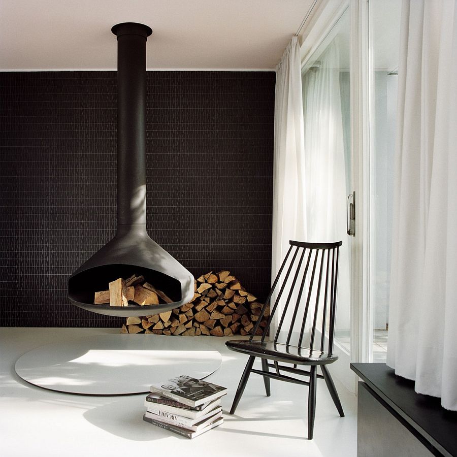 Decorating with firewood around the stunning Fireorb fireplace in black