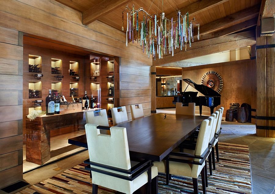 Dining area with wine storage and a unique lighting fixture