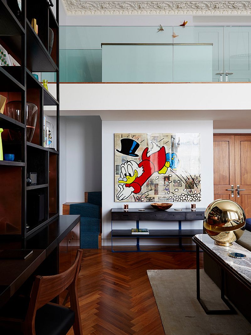 Disney-themed Alec Monopoly painting adds playfulness to the contemporary living room [Design: Violet & George]