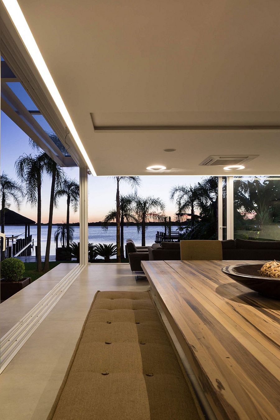 Ergonomic ambient lighting brings warmth to the stylish pool house