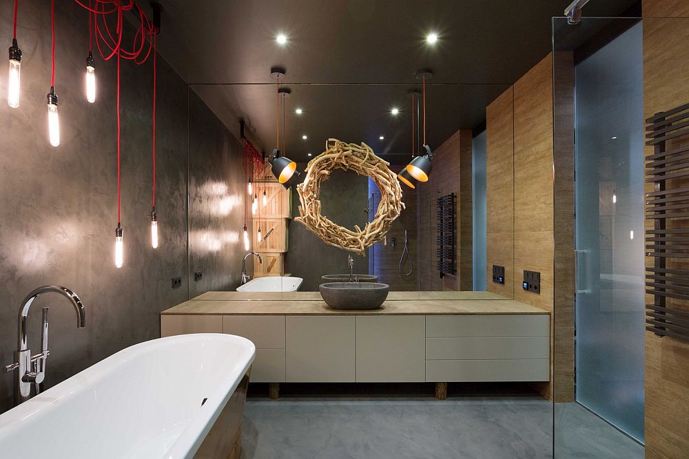 Fabulous industrail styled bathroom with a unique mirror above the vanity