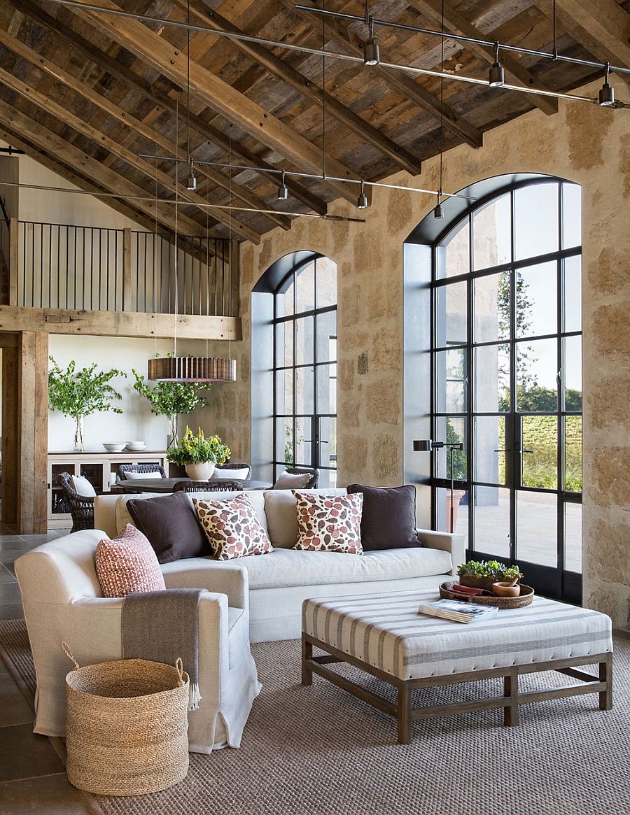 Family area with sweeping arches is connected with the kitchen and pool outside