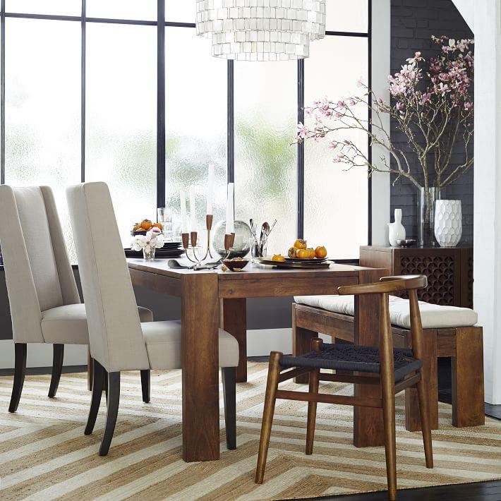 Flowering branches add drama to the dining room