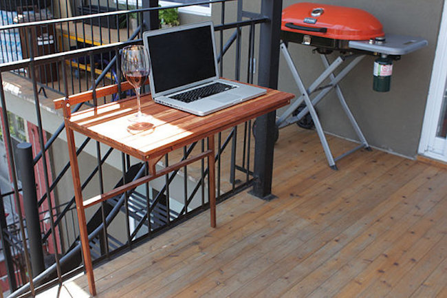 Foldable balcony table used as an outdoor workspace