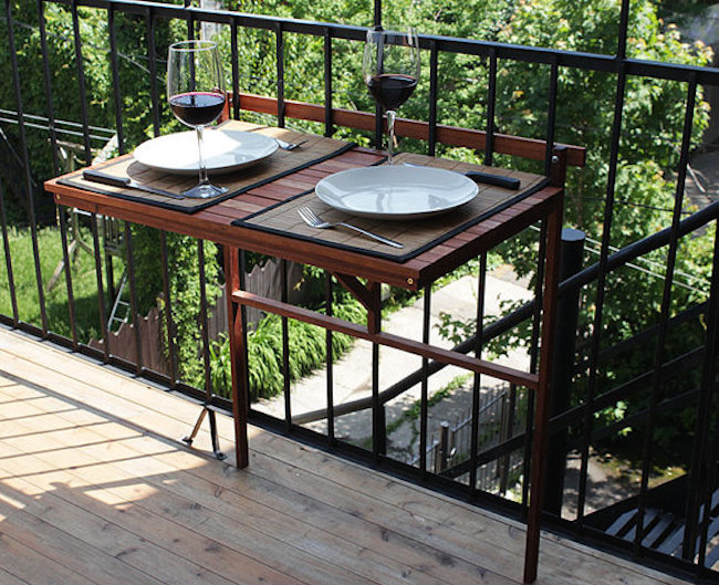 Foldable table attached to balcony