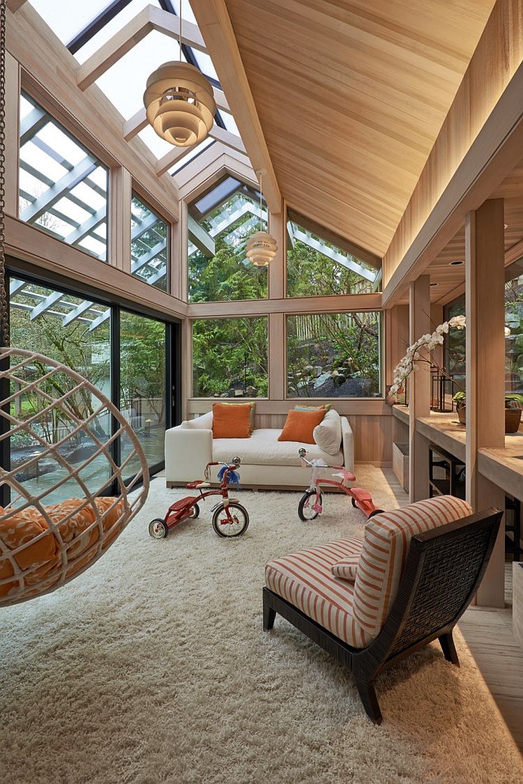 Gabled roof and woodsy warmth greet this contemporary sunroom [Design: Richard Brown Architect]
