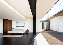Glass-doors-bring-the-outdoors-into-the-bedroom-with-ease-217x155
