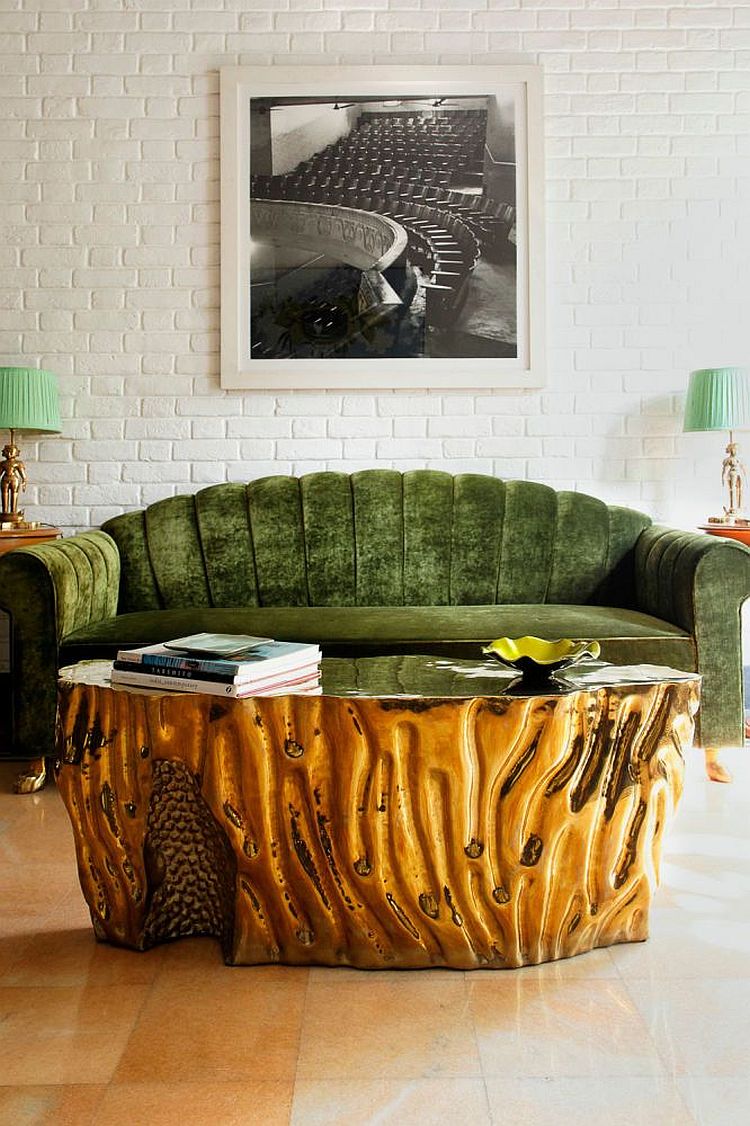 Gold Coffee table coupled with a lovely green couch [Design: Viya Interiors]