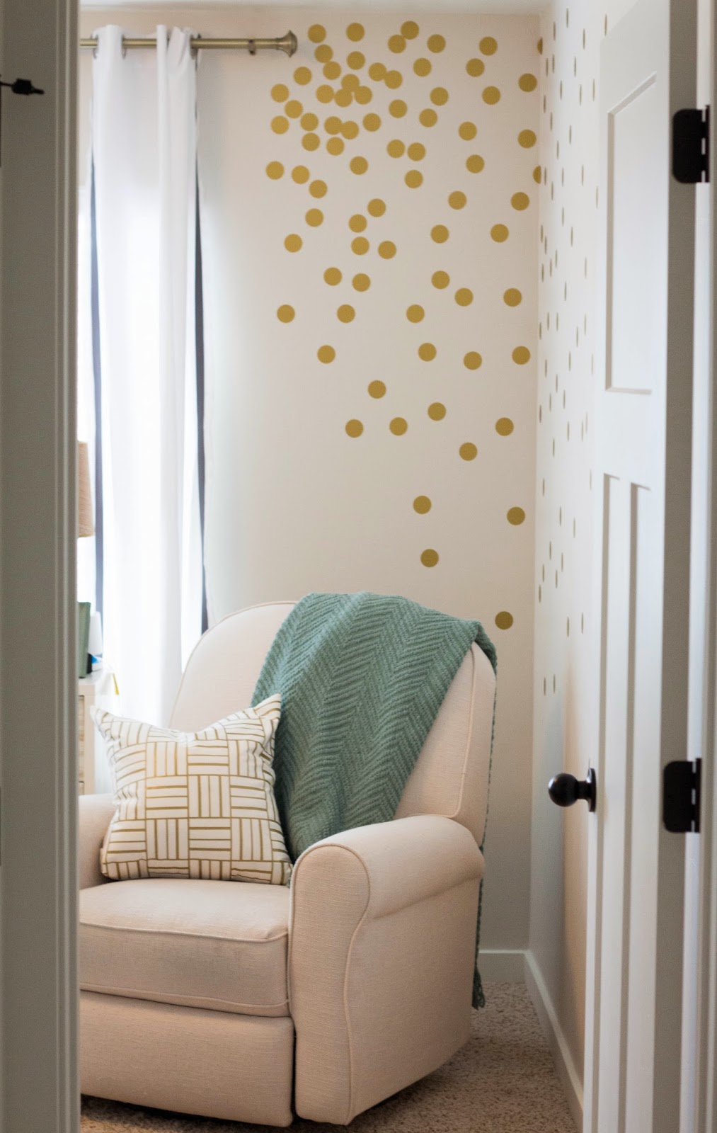 Gold polka dot wall decals in corner