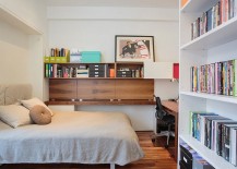 Guest-bedroom-and-home-office-with-ample-shelf-space-217x155